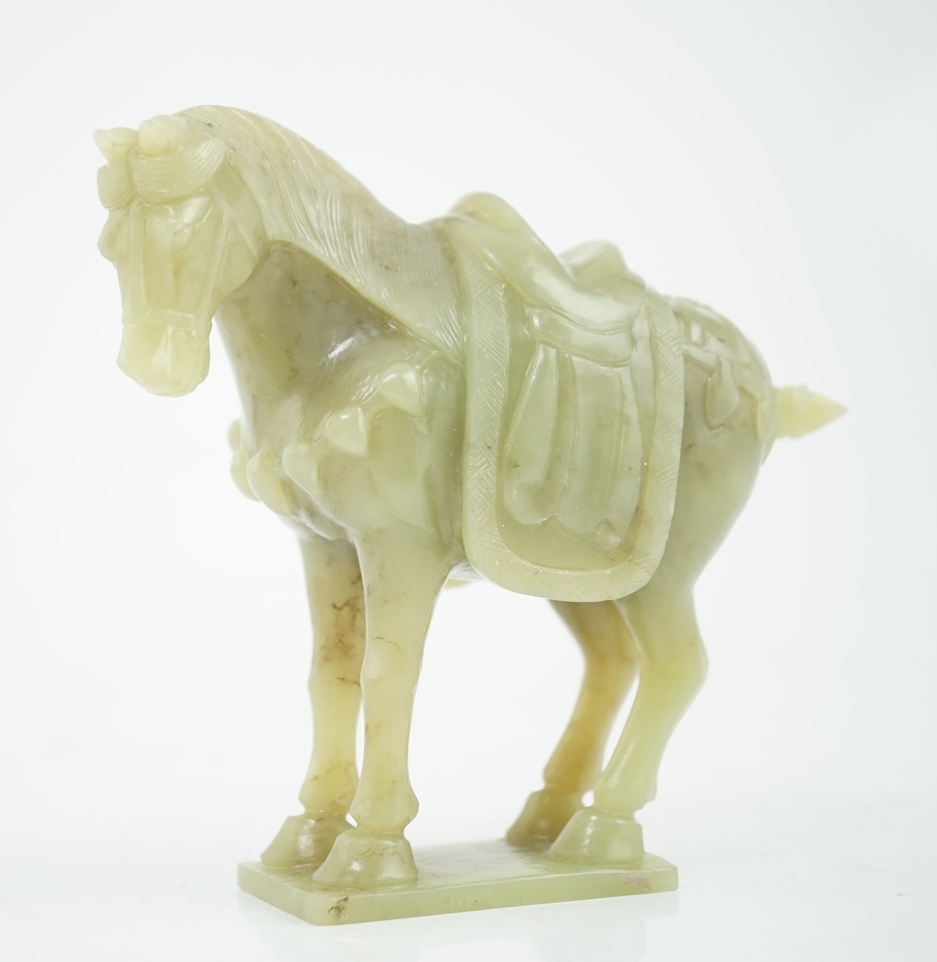 A Chinese celadon jade figure of a horse, early 20th century, 12cm high